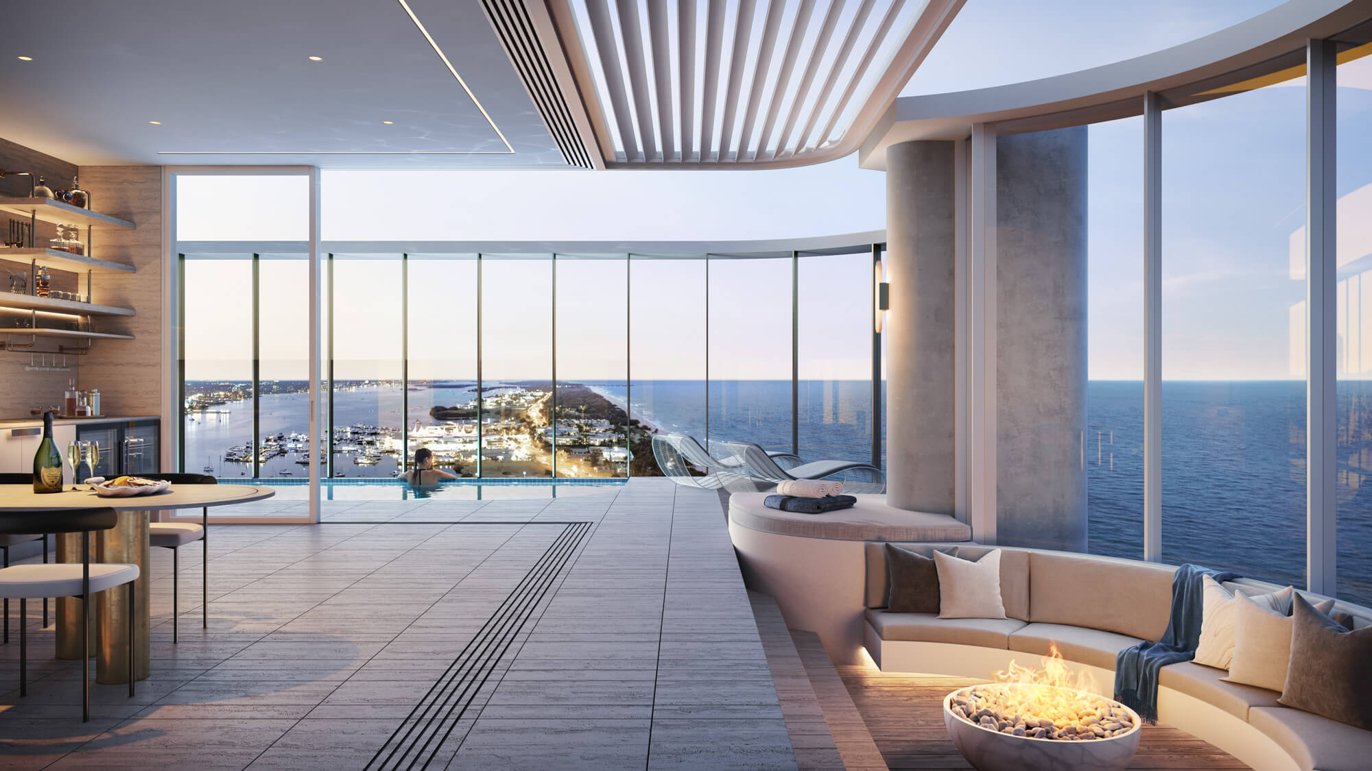 A modern living room featuring large windows that showcase a stunning view of the ocean.